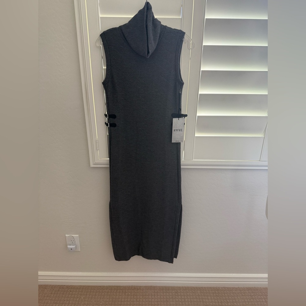Long straight sweater dress with cowl neck and long slits on each side.